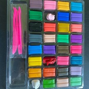 Polymer Clay. Some used other never touched. New set of tools that come with it.